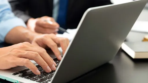 Hands working on a keyboard